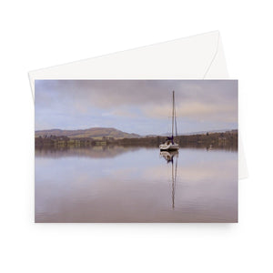 'Waiting for the Skipper' - High quality greeting card featuring my photograph of a lone sailboat at dawn on Grasmere in the Lake District. Printed on heavyweight 330gsm Fedrigoni card. Supplied with envelope.